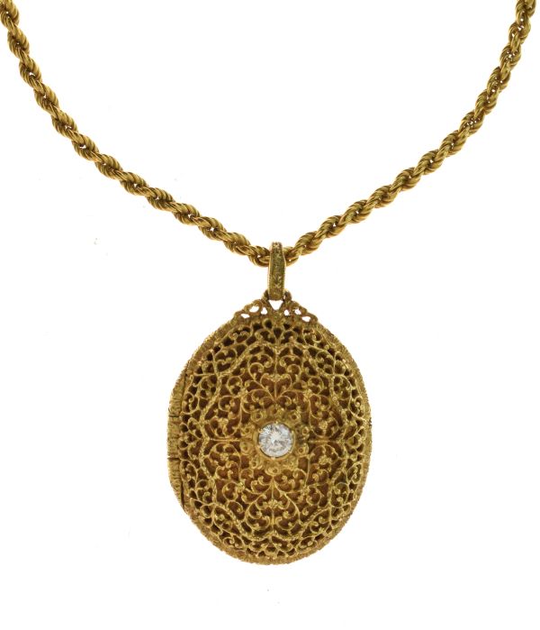 Gold diamond set locket, the brilliant cut of approximately 0.3 carats set to a pierced panel