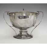 Edward VII silver bowl having three square top outswept handles and standing on a circular foot,