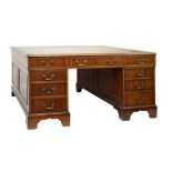 19th Century partner's mahogany desk, the moulded rectangular top with gilt-and blind-tooled tan