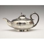 William IV silver teapot of squat circular form, the hinged cover having a greyhound knop, scroll