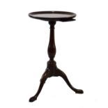 George III mahogany kettle stand, the dished circular top with pull-out slide beneath on slender