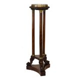 19th Century rosewood torchère or vase stand, the circular top with scroll pierced brass gallery