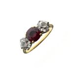 Diamond and ruby three stone 18ct gold ring, the cushion shaped ruby approximately 6mm x 6mm x 3.3mm