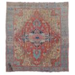 Large Caucasian wool carpet, the red field with central star medallion, within foliate designs,