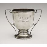 A silver two handled cup given to C.F.A. Voysey on his 70th birthday and engraved 'C.F.A.V. 28th May