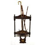 Early 20th Century oak corner stickstand with three assorted sticks, together with a mounted set