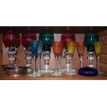 Selection of coloured glassware to include; five roemer-style drinking glasses, each with coloured