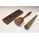 19th Century carved walnut mould, a walnut mallet and a peg Condition: