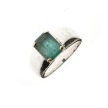 White metal ring set rectangular green stone, the shank stamped 18k, size R, 13.1g approx gross