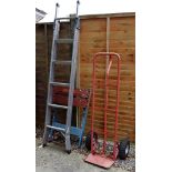 Youngman three way combination aluminium ladder, red finished metal sack barrow, and a work bench