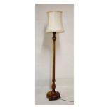 Early 20th Century beech standard lamp with reeded cylindrical column stem on spreading circular