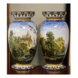 Pair of 19th Century Gien faience ovoid baluster vases, each painted with a landscape with ruins,