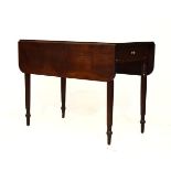 Early 19th Century mahogany Pembroke table having rounded flaps over frieze drawer on turned