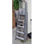 Two sets of aluminium folding steps of four and five treads respectively Condition: