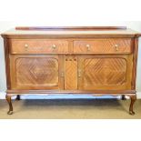 Early 20th Century mahogany sideboard having a breakfront top over two projecting drawers and a pair