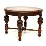 Early 20th Century oak occasional or coffee table with moulded circular top on bulbous supports