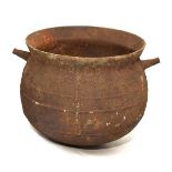 Iron cauldron or cooking pot of two piece construction with conical lug handles Condition: