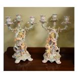 Pair of late 19th Century Plaue-on-Havel three branch candelabra, each having figural decoration