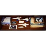 Assorted Concorde memorabilia to include; three model aircraft, DVD's and videos, framed
