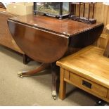 Reproduction Regency style drop leaf pedestal centre table, with semi-circular flaps having reeded