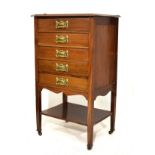 Edwardian mahogany music cabinet fitted one fall front drawer and four standard drawers, platform
