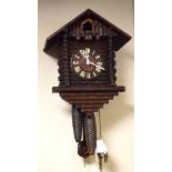 Late 19th/early 20th Century Black Forest cuckoo clock, the case formed as a log cabin Condition: