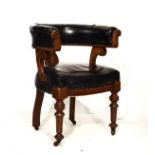 Late Victorian walnut framed tub shaped drawing room chair upholstered in black leatherette and