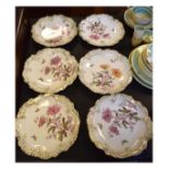 Set of six late 19th/early 20th Century French Limoges porcelain dessert plates, each depicting