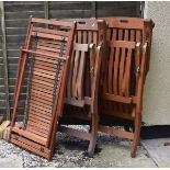 Three hardwood steamer type deckchairs comprising: a pair and a single Condition: