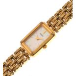 Lady's Seiko gold plated wristwatch, with mother-of-pearl rectangular dial on gate link bracelet