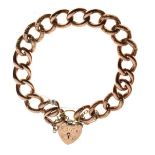 9ct gold curb link bracelet having chased decoration and with a padlock clasp, 21g approx Condition: