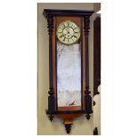 Late 19th Century walnut and ebonised cased Vienna style single weight wall clock, having a raised
