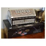 Oriental black lacquer box of rectangular form, the hinged cover inlaid with birds in mother-of-