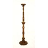 Carved giltwood torchère or lamp standard having a carved and reeded pillar and standing on a