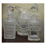 Two cut glass whisky decanters and a cut glass pedestal water jug Condition: