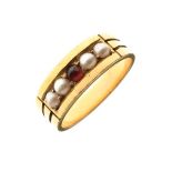 Unmarked yellow metal ring set central red stone flanked by two pearls to either side, size K½, 4.8g