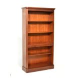 Reproduction mahogany open bookcase with moulded cornice over five shelves Condition: