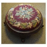 Victorian walnut framed circular footstool having a beadwork applied circular seat on stipple carved