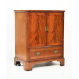 Reproduction mahogany stereo/TV cabinet with crossbanded canted top over fluted corners and a pair