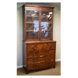 Early 19th Century mahogany secretaire bookcase, the upper stage with cavetto moulded top over a