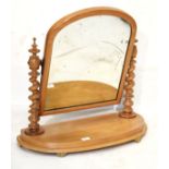 Victorian swing dressing mirror with arched plain mirror plate between spiral twist uprights on a