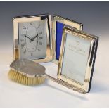 Elizabeth II silver picture frame, Sheffield 2000, a silver backed hair brush, Birmingham 1958 and a