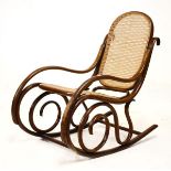 Early 20th Century lady's bentwood rocking chair having a split cane seat and back Condition: