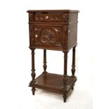 French carved oak pot cupboard, the moulded square top over carved frieze drawer and cupboard with