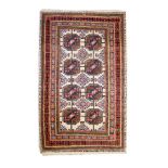 Modern Middle Eastern rug, the central field decorated with eight medallions on a cream ground