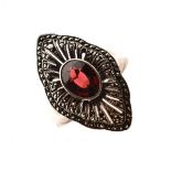 Unmarked white metal ring set faceted oval red garnet coloured stone within marquisate navette