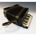 Early 20th Century piano accordion having ebonised case and leather carry straps Condition: