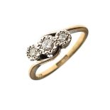 Yellow metal ring set three diamonds in crossover design, the shank stamped '9ct Plat', size M, 2.6g