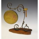 Early 20th Century scrolling brass dinner gong on a leaf design oak plinth, 38cm high Condition: