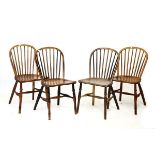 Four 19th Century ash, elm and fruitwood hoop back country chairs of Windsor type, each with